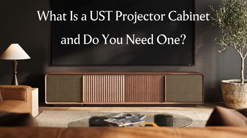 Modern living room with a UST projector cabinet beneath a large screen, introducing what a dedicated ultra short throw projector cabinet is.