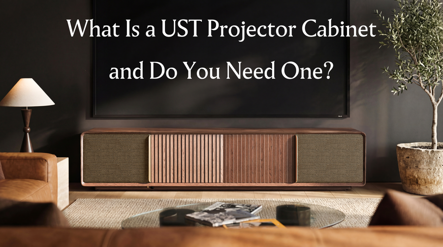 Modern living room with a UST projector cabinet beneath a large screen, introducing what a dedicated ultra short throw projector cabinet is.