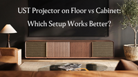 Wooden UST projector cabinet beneath a large screen, introducing a floor vs cabinet comparison for ultra short throw projector placement.
