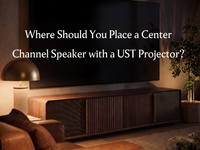 Wooden UST projector cabinet beneath a large screen in a living room, introducing center channel speaker placement for a UST projector setup.