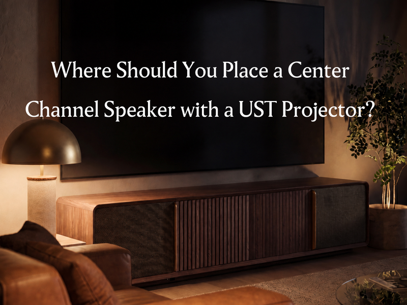 Wooden UST projector cabinet beneath a large screen in a living room, introducing center channel speaker placement for a UST projector setup.